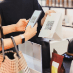 A woman is using a tablet to check out a bag and leave a google review at a store.
